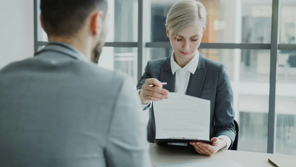 General Employment Permit requirements Ireland — application documents on desk with Irish passport
