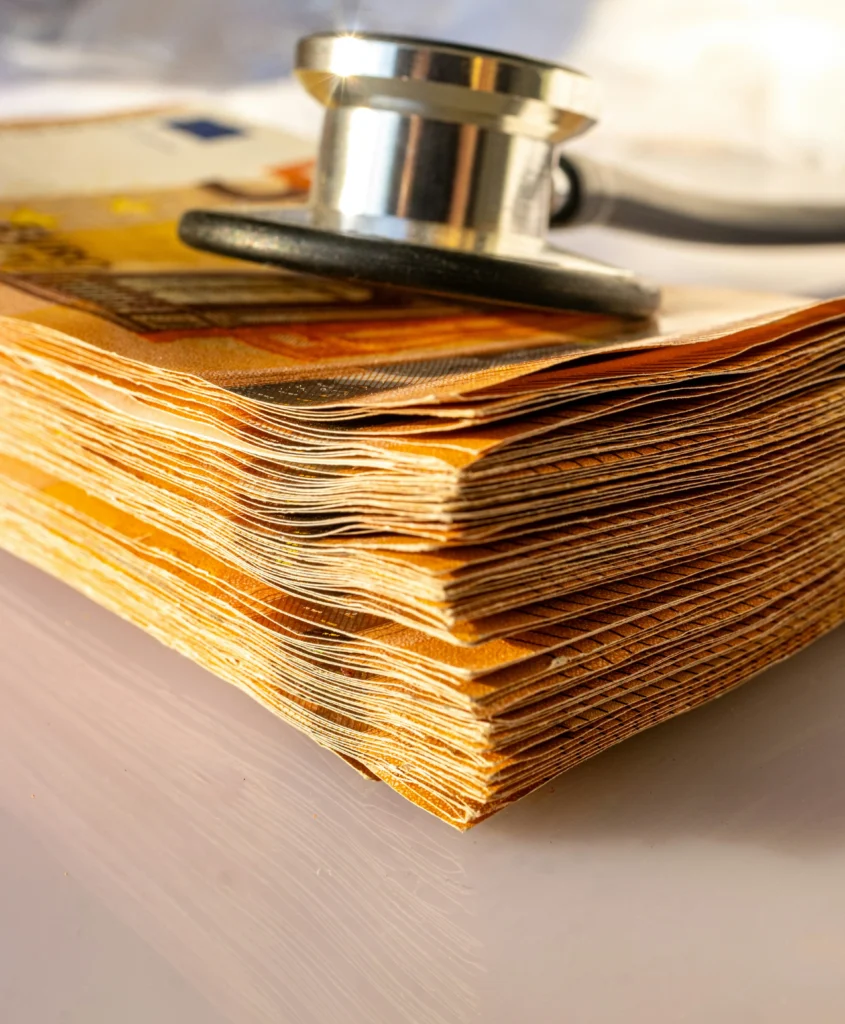Stethoscope and euro notes on a desk representing GP fees Ireland 2026 consultation costs
