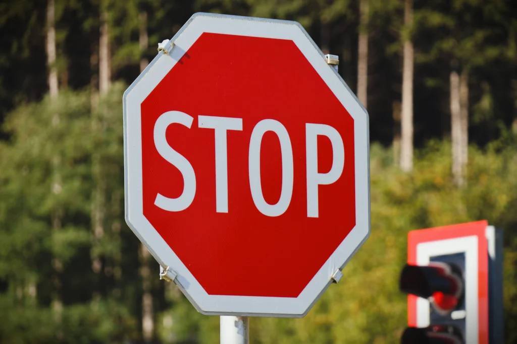 Foreign driver reviewing Irish road signs and driving licence in Ireland